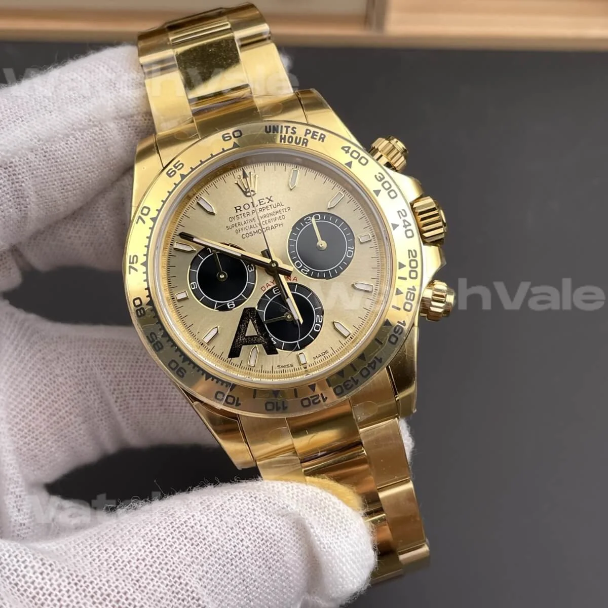 Front view of Rolex Daytona 116528 with champagne panda dial, tachymeter bezel, and Oyster bracelet