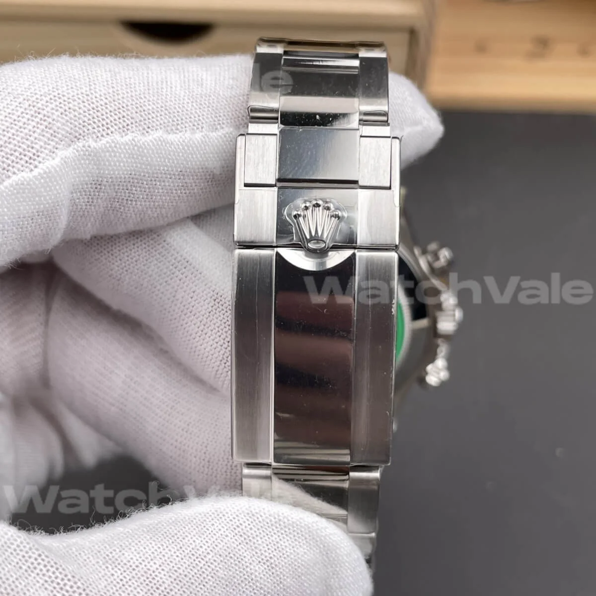 Rolex Daytona 126599TRU Super Clone Replica featuring black dial and diamond-set lugs