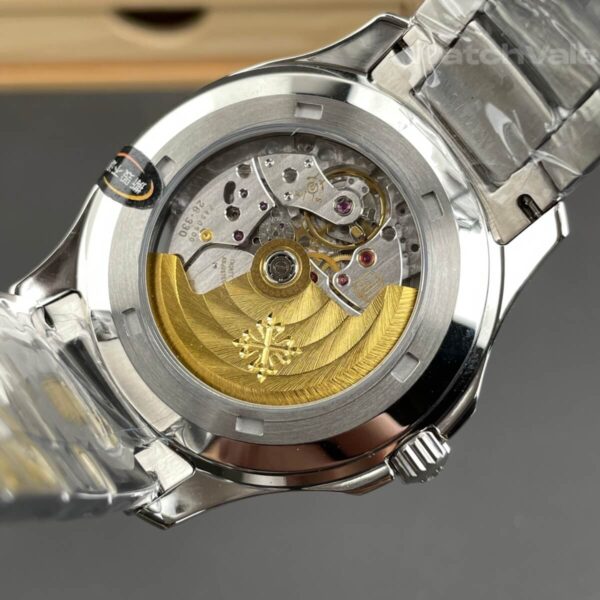 Black dial replica watch with white gold hour markers close-up