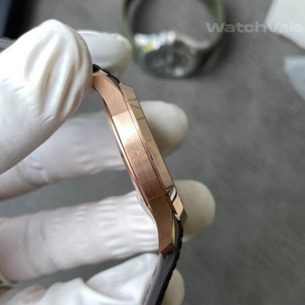Brown dial replica watch with rose gold hour markers close-up