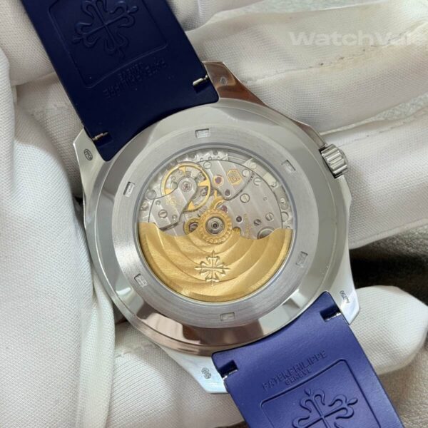 Blue dial replica watch with applied white gold hour markers close-up