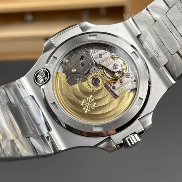 White dial replica watch with blued steel hands and date window close-up