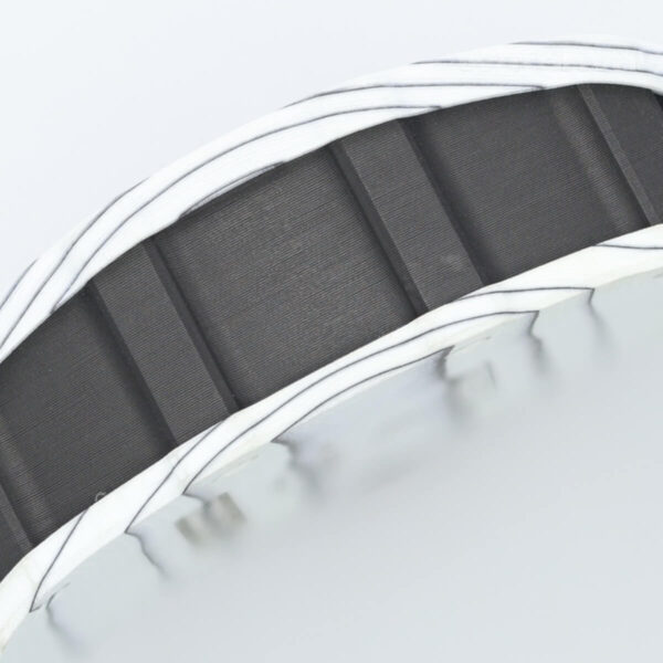 Skeleton dial replica watch with exposed bridges and gear train close-up