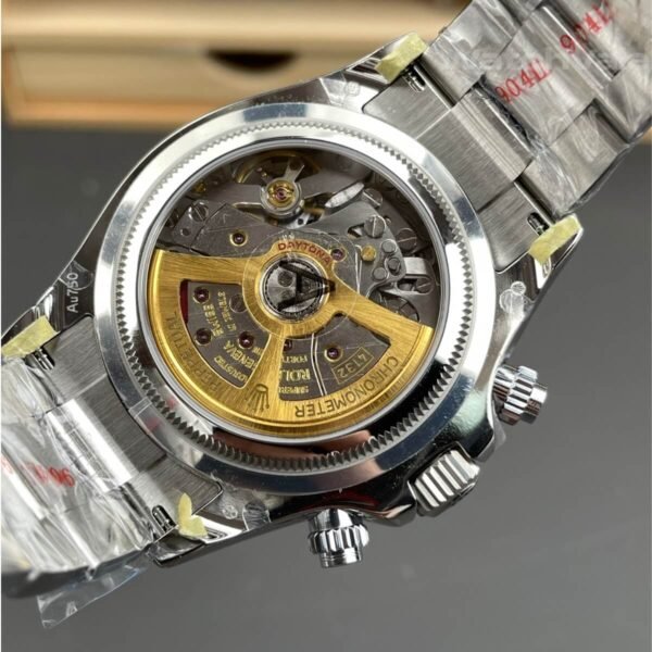 Black dial replica watch with white gold hour markers close-up