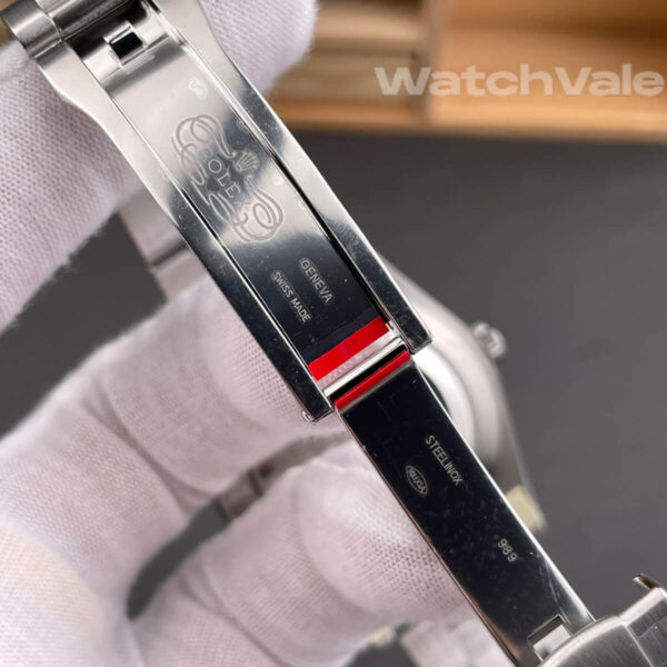 Rolex Oyster Perpetual 134300 pistachio dial close-up replica watch